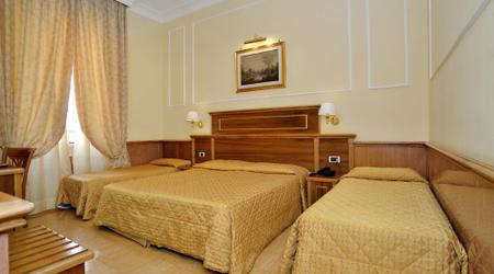 QUADRUPLE  STANDARD ROOM  Hotel Palladium Palace Roma QUADRUPLE  STANDARD ROOM  Hotel Palladium Palace Roma